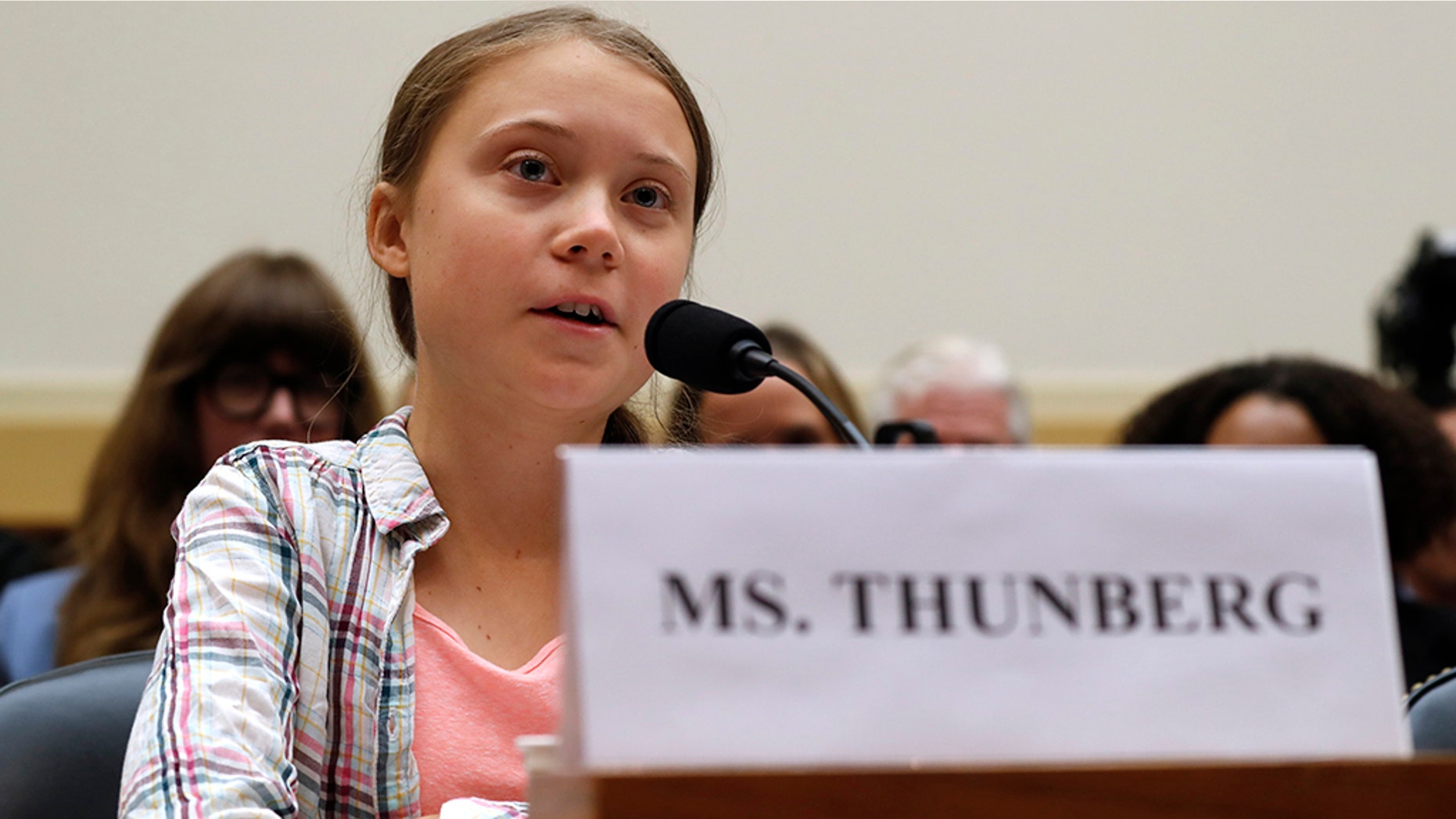 Youth climate change activist Greta Thunberg, left, speaks at a House Foreign Affairs Committee subcommittee hearing on climate change Wednesday, Sept. 18, 2019, on Capitol Hill in Washington. (AP Photo/Jacquelyn Martin)