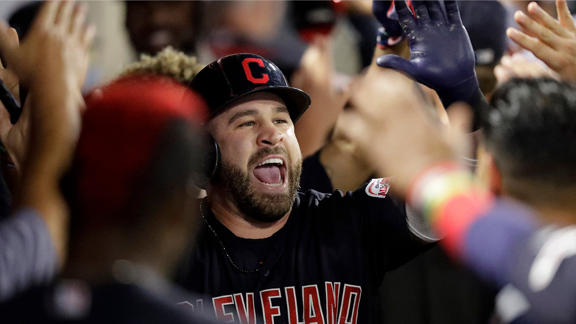 Cleveland Indians' Jason Kipnis celebrates in the dugout after a two-run home run against the Los Angeles Angels during the second inning of a baseball game in Anaheim, Calif., Monday, Sept. 9, 2019. (AP Photo/Chris Carlson)