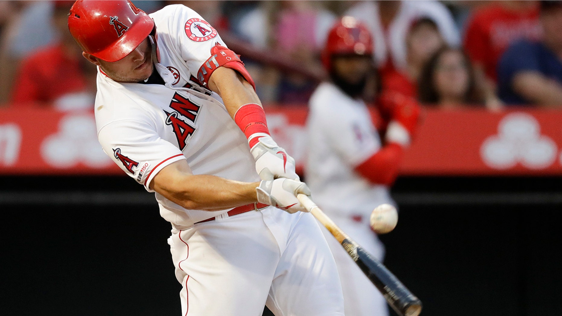 Los Angeles Angels' Mike Trout hits a RBI-single against the Boston Red Sox during the second inning of a baseball game in Anaheim, Calif., Saturday, Aug. 31, 2019. (AP Photo/Chris Carlson)