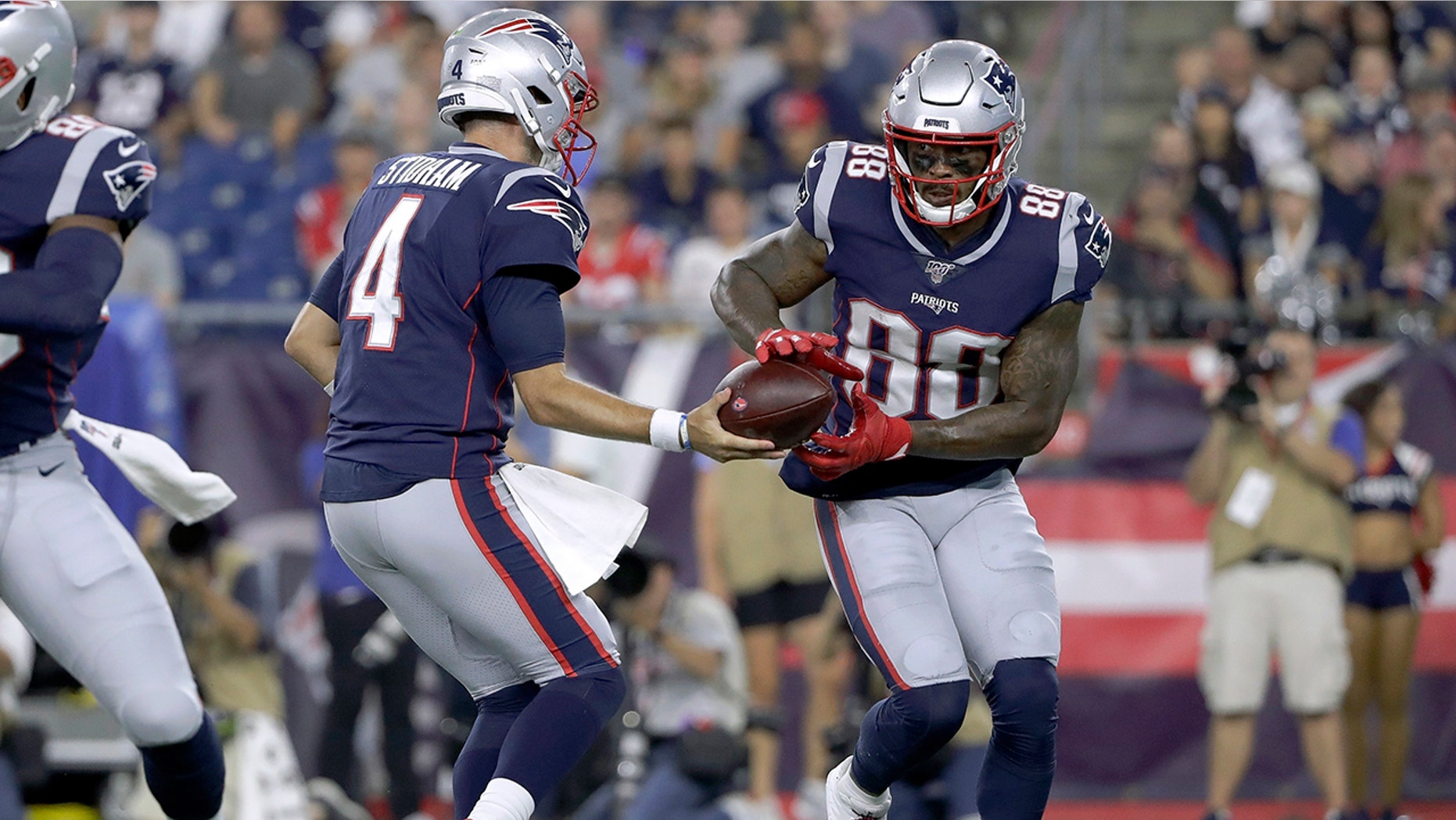 FILE - In this Thursday, Aug. 29, 2019 file photo, New England Patriots quarterback Jarrett Stidham, left, hands off to wide receiver Demaryius Thomas (88) in the first half of an NFL preseason football game in Foxborough, Mass. A person with direct knowledge of the deal says the New York Jets have acquired wide receiver Demaryius Thomas from the New England Patriots for a 2021 sixth-round draft pick. The person spoke to The Associated Press on condition of anonymity Tuesday, Sept. 10, 2019 because the teams had not yet announced the trade. (AP Photo/Steven Senne, File)