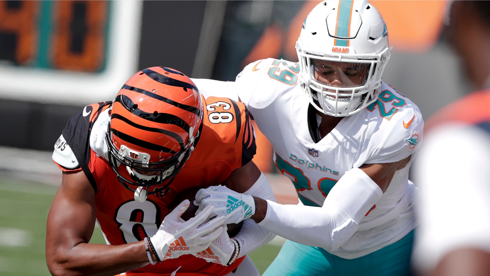 FILE - In this Oct. 7, 2018, file photo, Miami Dolphins' Minkah Fitzpatrick (29) tackles Cincinnati Bengals wide receiver Tyler Boyd (83) after a catch during the first half of an NFL football game in Cincinnati. A person familiar with the negotiations says Fitzpatrick has been traded to the Pittsburgh Steelers for a first-round draft pick in 2020. The person confirmed the trade to The Associated Press on condition of anonymity Monday, Sept. 16, 2019, night because the teams had not confirmed it. (AP Photo/Michael Conroy, File)