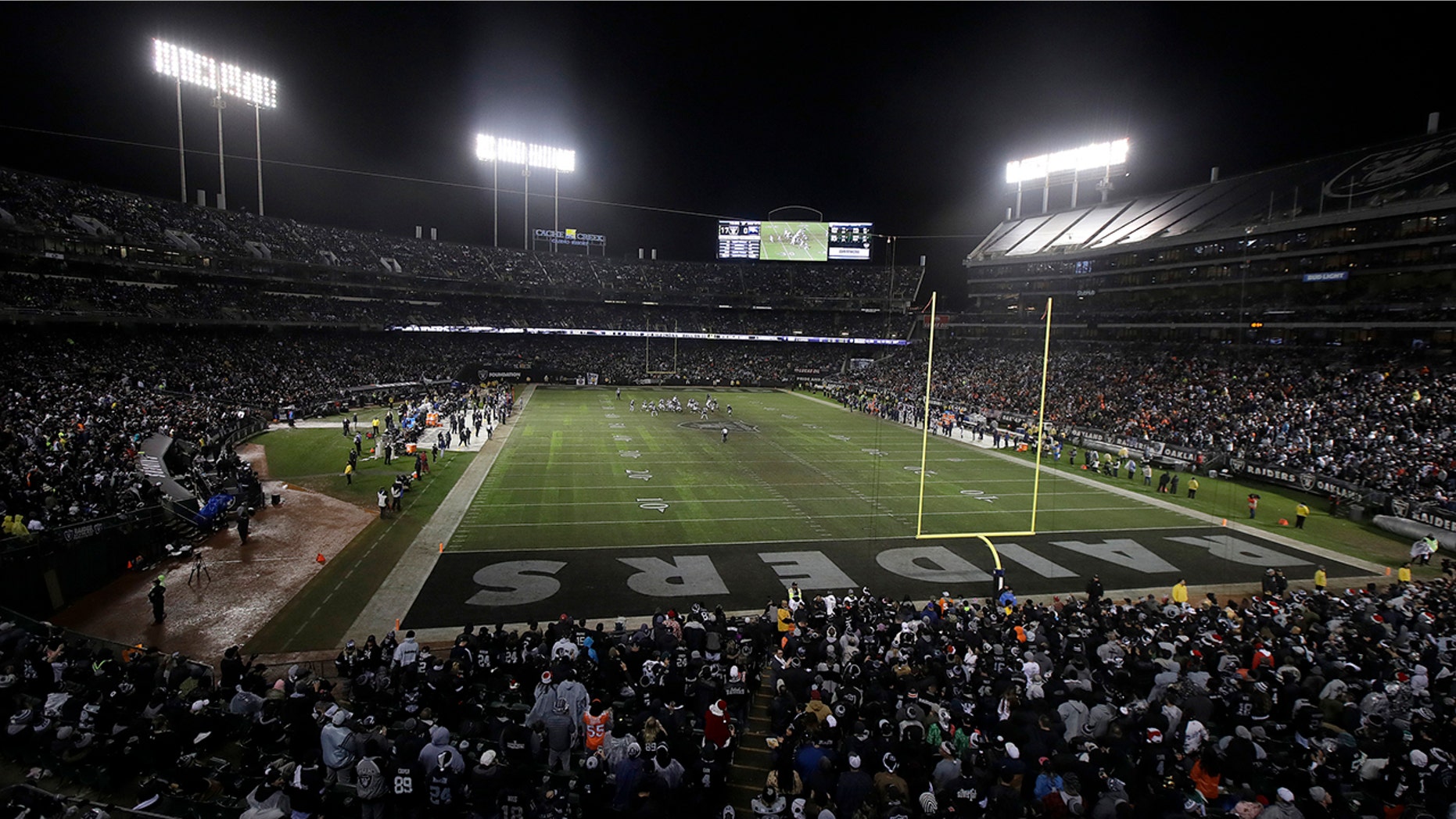 FILE - In this Dec. 24, 2018, file photo, fans watch from a general view at Oakland Alameda County Coliseum during the second half of an NFL football game between the Oakland Raiders and the Denver Broncos in Oakland, Calif. (AP Photo/Jeff Chiu, File)