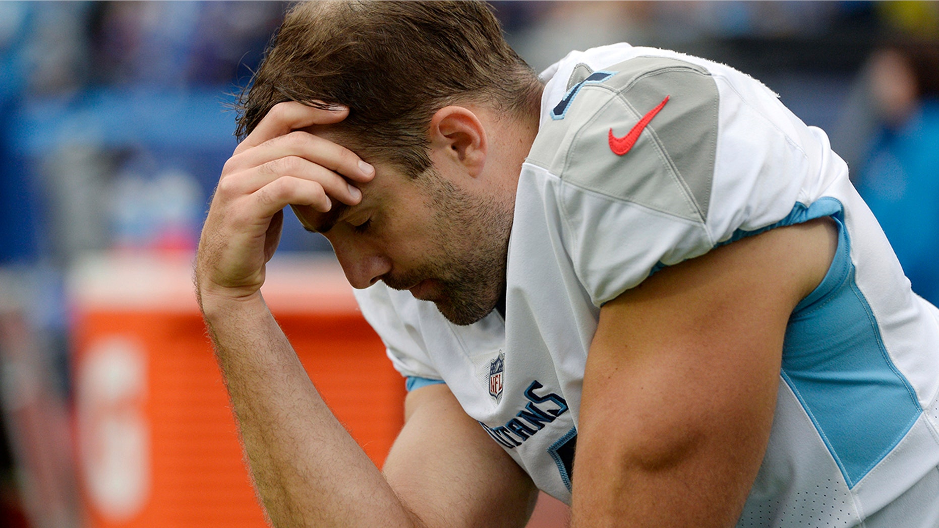 FILE - In this Oct. 7, 2018, file photo, Tennessee Titans kicker Ryan Succop takes a quiet moment on the sideline during the second half of an NFL football game against the Buffalo Bills, in Orchard Park, N.Y. The Titans have placed kicker Ryan Succop on injured reserve and have added veteran Cairo Santos to take over for him. Succop hadn’t missed a game in five seasons with the Titans but had been recovering from offseason knee surgery. (AP Photo/Adrian Kraus, File)