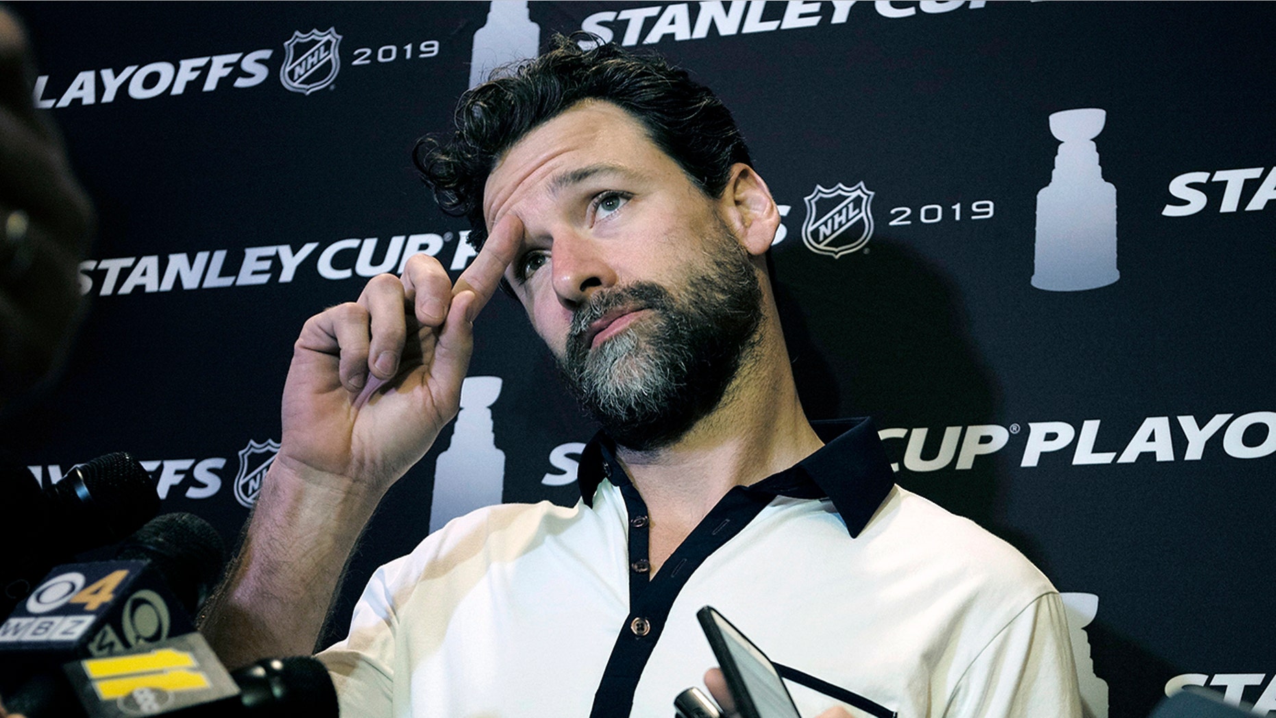 FILE - In this Wednesday, May 8, 2019, file photo, Carolina Hurricanes' Justin Williams talks with reporters during an NHL hockey media availability in Boston. Hurricanes captain Justin Williams says he is taking a break from the NHL to start this season. The 37-year-old forward said in a statement Monday, Sept. 2, 2019, that he will “step away” from the sport. (AP Photo/Steven Senne, File)