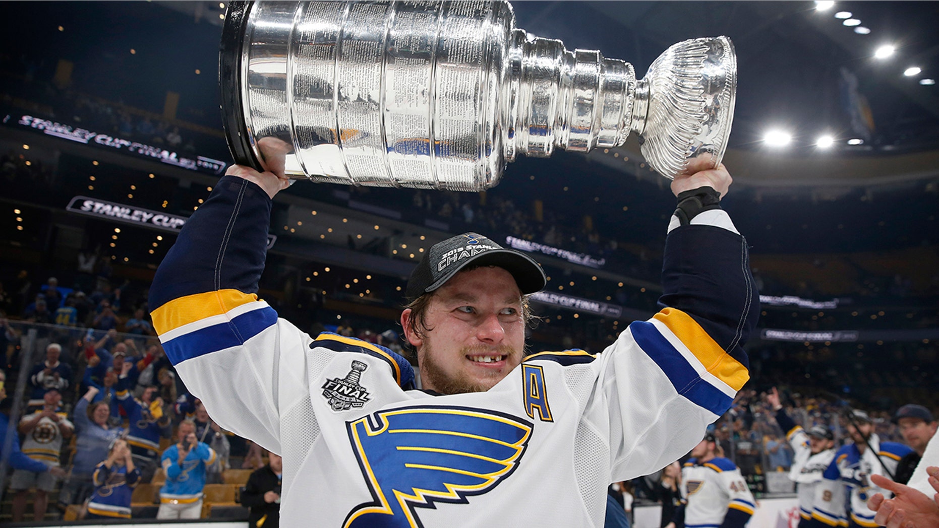 FILE - In this June 12, 2019, file photo, St. Louis Blues' Vladimir Tarasenko, of Russia, carries the Stanley Cup after the team defeated the Boston Bruins in Game 7 of the NHL Stanley Cup Final in Boston. (AP Photo/Michael Dwyer, File)
