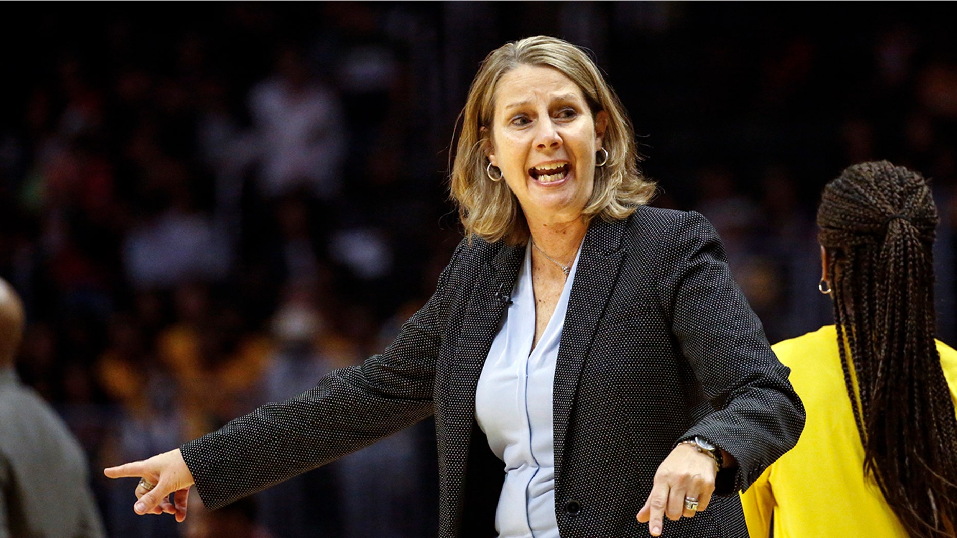 FILE - In this Sunday, Sept. 8, 2019 file photo, Minnesota Lynx's head coach Cheryl Reeve instructs her players during a WNBA basketball game against the Los Angeles Sparks in Los Angeles. Minnesota Lynx general manager and coach Cheryl Reeve has been chosen WNBA basketball executive of the year after steering the team to a ninth straight appearance in the playoffs despite losing several longtime stars, Wednesday, Sept. 18, 2019. (AP Photo/Ringo H.W. Chiu, File)