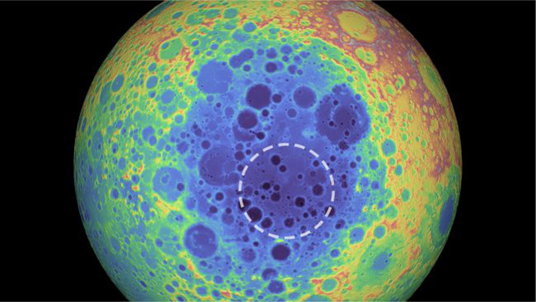 The South Pole-Aitken basin (represented by the shades of blue at the center) stretches 1,550 miles (2,500 kilometers) across and is one of the solar system’s largest craters. The dashed circle indicates the spot where researchers found a weird material beneath the basin that contains metal. (Credit: NASA/Goddard Space Flight Center/University of Arizona)