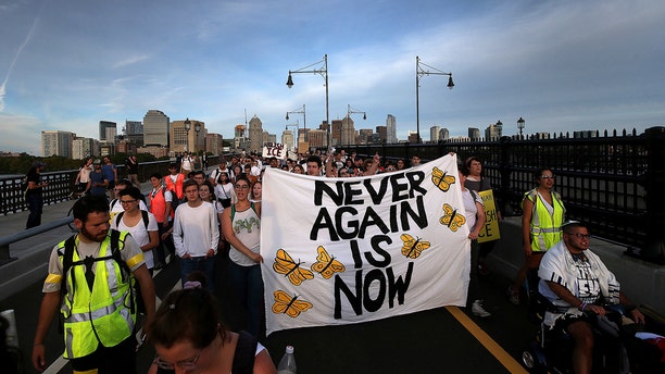 "Never Again Is Now" protesters rally at the New England Holocaust Memorial and then march across the Longfellow bridge into the Amazon local business building lobby, Thursday, Sept. 5, 2019 in Cambridge, Mass. (Associated Press)