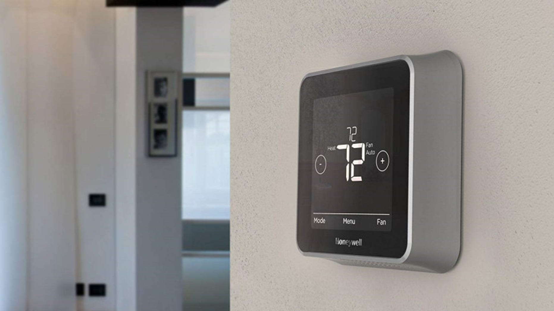 A Honeywell intelligent thermostat is seen above.