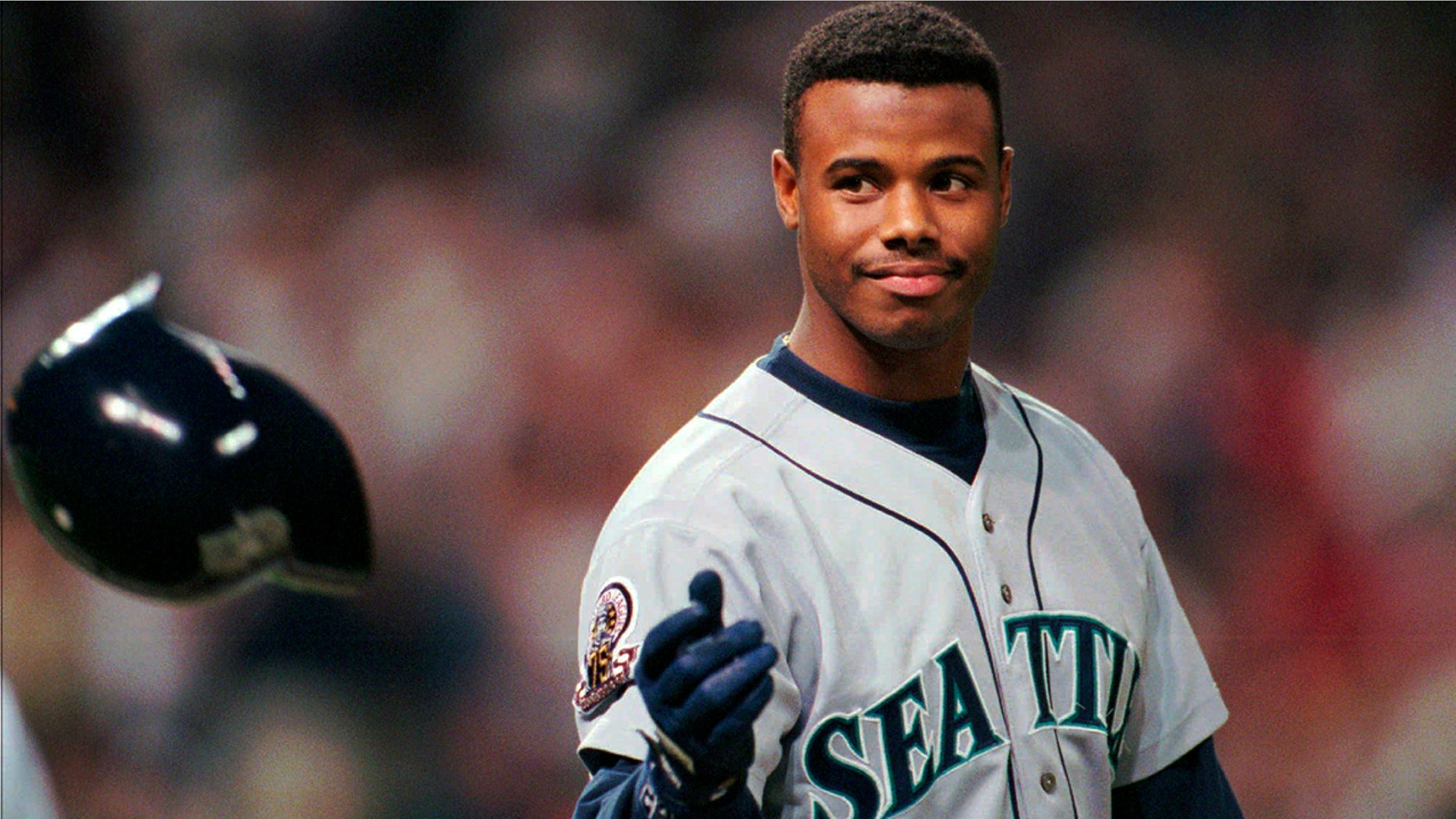 FILE - In this Oct. 13, 1995, file photo, Seattle Mariners Ken Griffey Jr. tosses his batting helmet after grounding out in the eighth inning against the Cleveland Indians in an ALCS game in Cleveland. The Seattle Mariners are the only baseball franchise never to advance to the Fall Classic. Baseball has never been played in Seattle beyond Oct. 22. The Mariners have three times been to the American League Championship Series, and all three times were sent home before there could ever be a Game 7. (AP Photo/Mark Duncan, File)