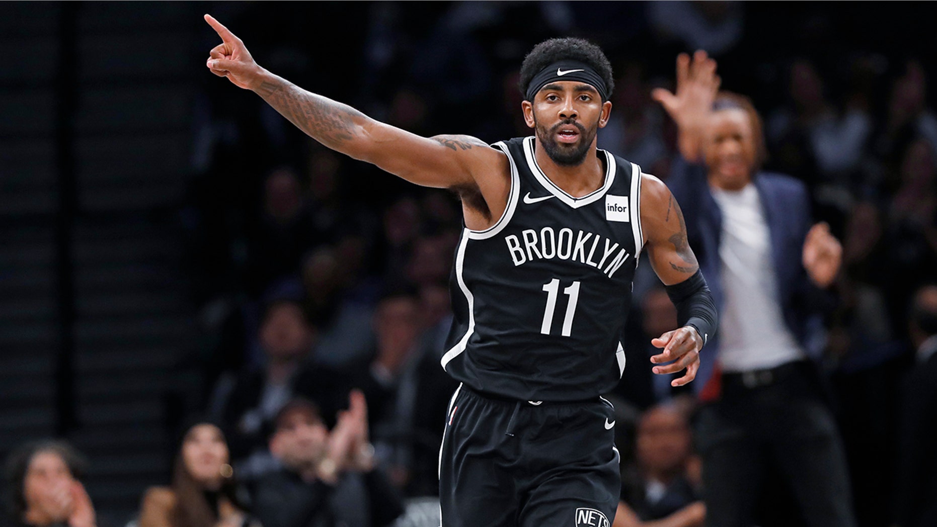 Brooklyn Nets guard Kyrie Irving (11) celebrates after scoring during the first half of the team's NBA basketball game against the Minnesota Timberwolves, Wednesday, Oct. 23, 2019, in New York. Irving had 50 points but the Nets fell to the Timberwolves in overtime, 127-126. (AP Photo/Kathy Willens)