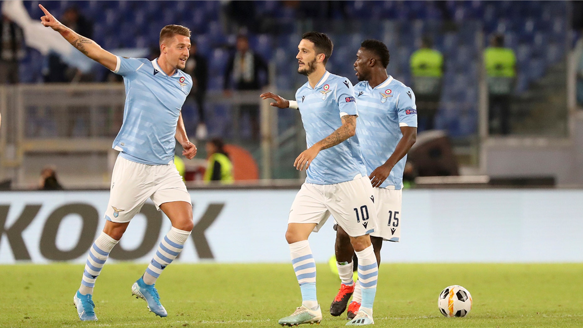 Lazio's Sergej Milinkovic-Savic, left, celebrates after scoring his side's first goal during the Europa League Group E soccer match between Lazio and Rennes, at Rome's Olympic Stadium, Thursday, Oct. 3, 2019. (AP Photo/Alessandra Tarantino)