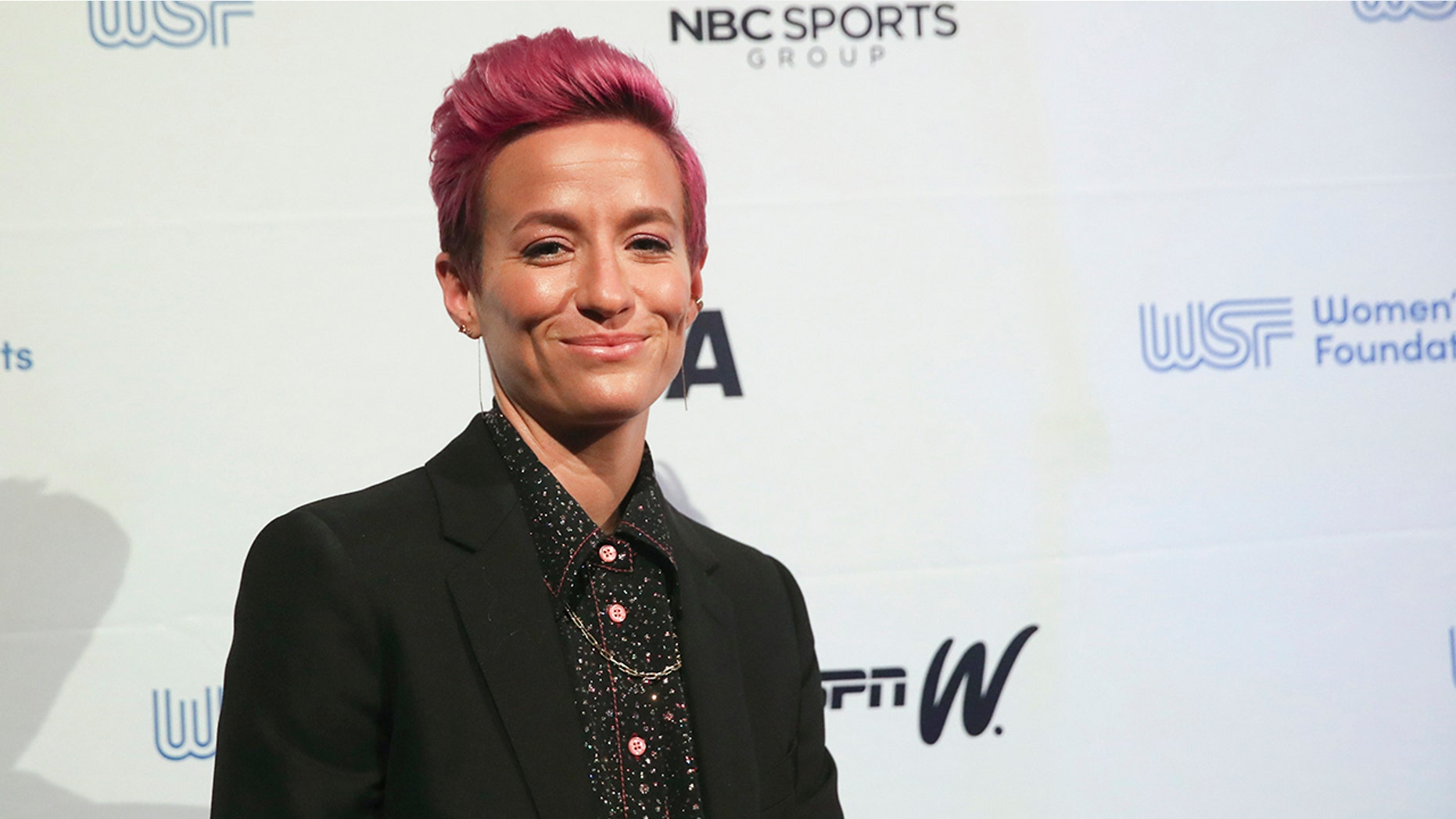 In this Wednesday, Oct. 16, 2019, photo soccer star Megan Rapinoe poses for photos on the red carpet of the Women's Sports Foundation's 40th annual Salute to Women in Sports in New York. Rapinoe, who was honored at the gala, won Sportswoman of the Year in the team category. She led the U.S. women's soccer team to victory at the World Cup in France and earned the FIFA Player of the Year award. (AP Photo/Mary Altaffer)