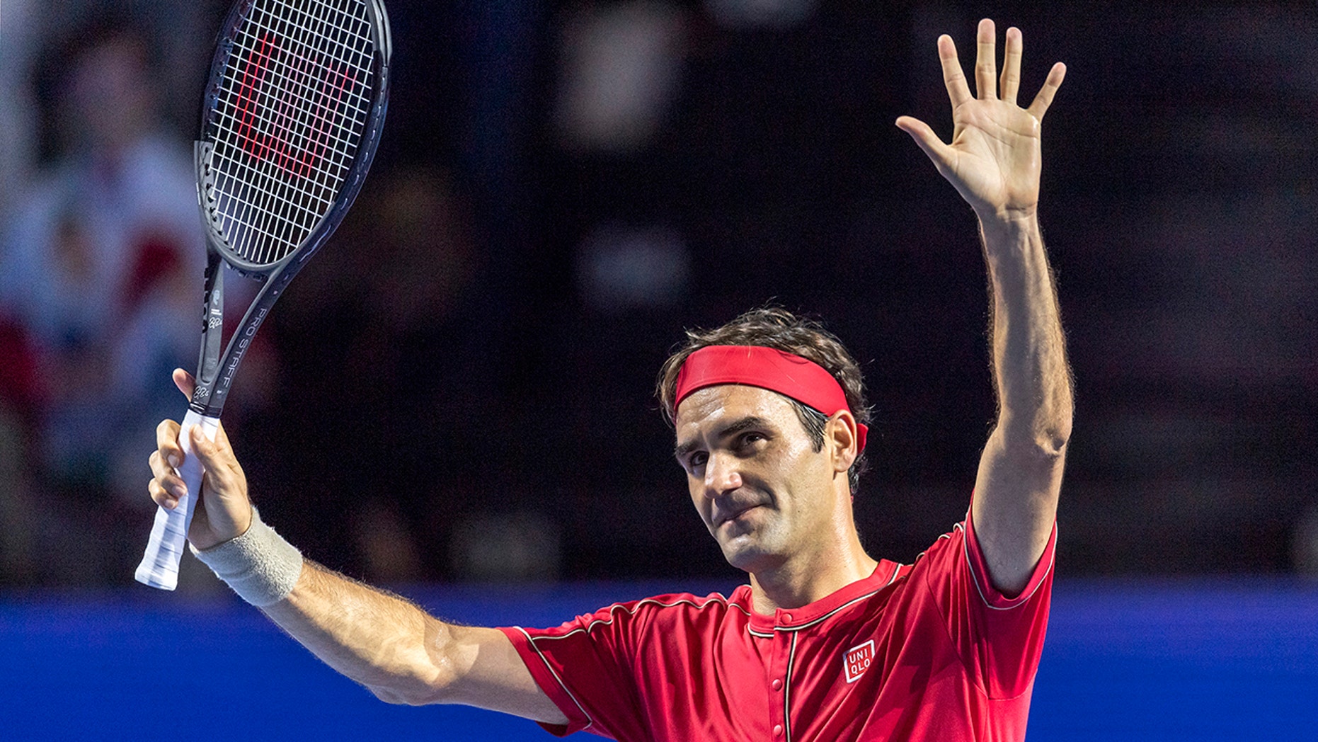 Switzerland's Roger Federer acknowledges the crowd after winning his first round match against Germany's Peter Gojowczyk at the Swiss Indoor tennis tournament at the St. Jakobshalle in Basel, Switzerland, on Monday, Oct. 21, 2019. (Georgios Kefalas/Keystone via AP)