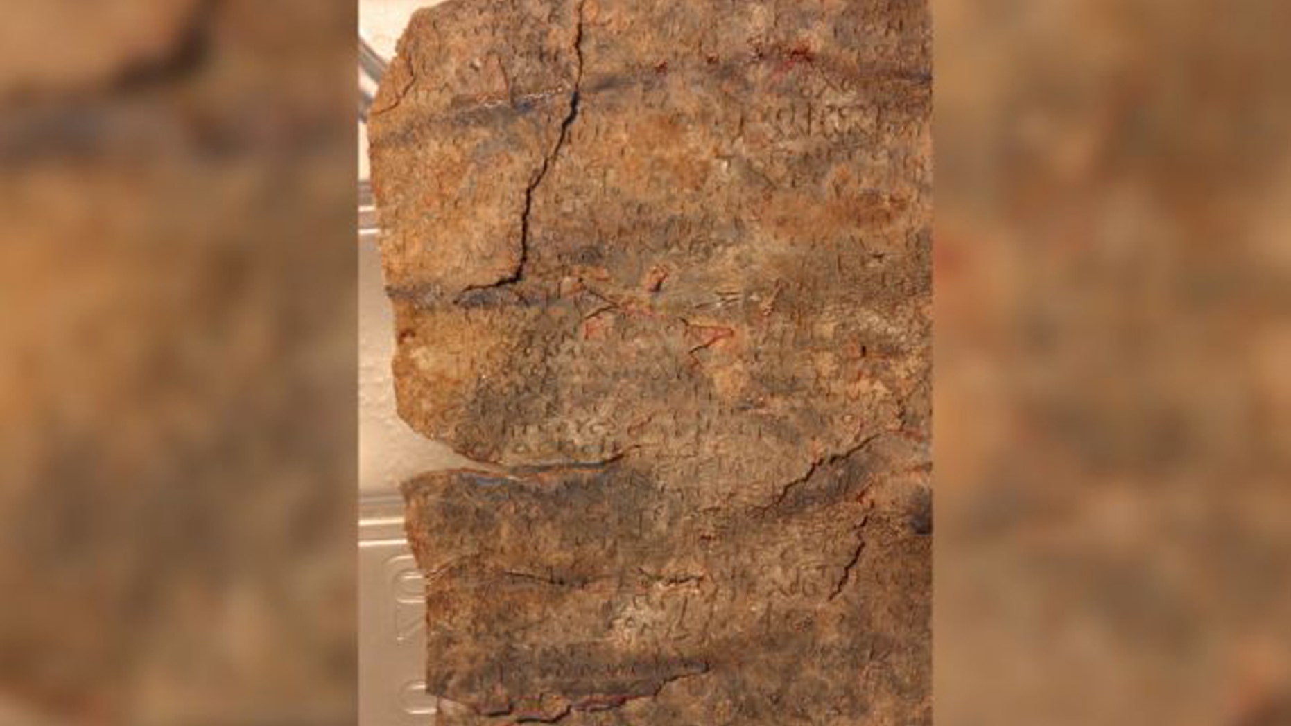 This recently deciphered 1,500-year-old curse tablet is written in Greek on a lead tablet. The curse is directed at a dancer named Manna. (Image: © Attilio Mastrocinque)