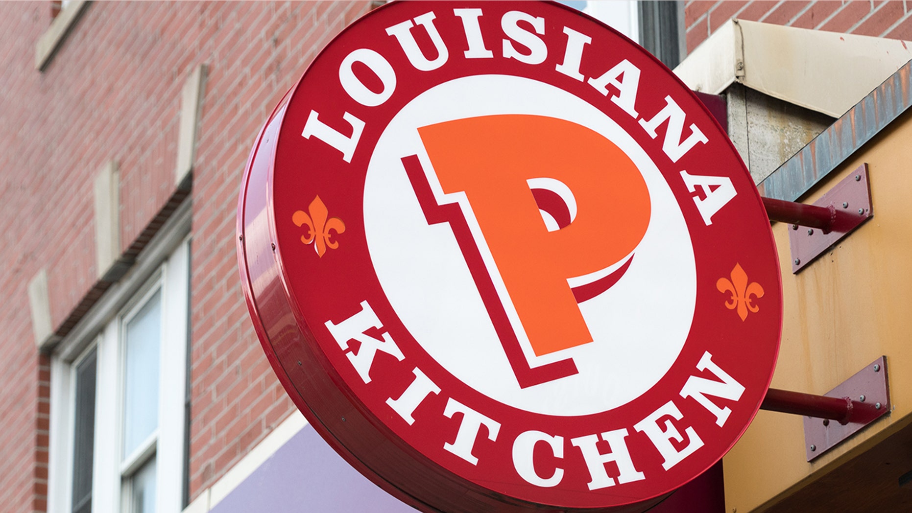 Popeyes Lousiana Kitchen sing or logo outside a restaurant wall. (Photo by Roberto Machado Noa/LightRocket via Getty Images)