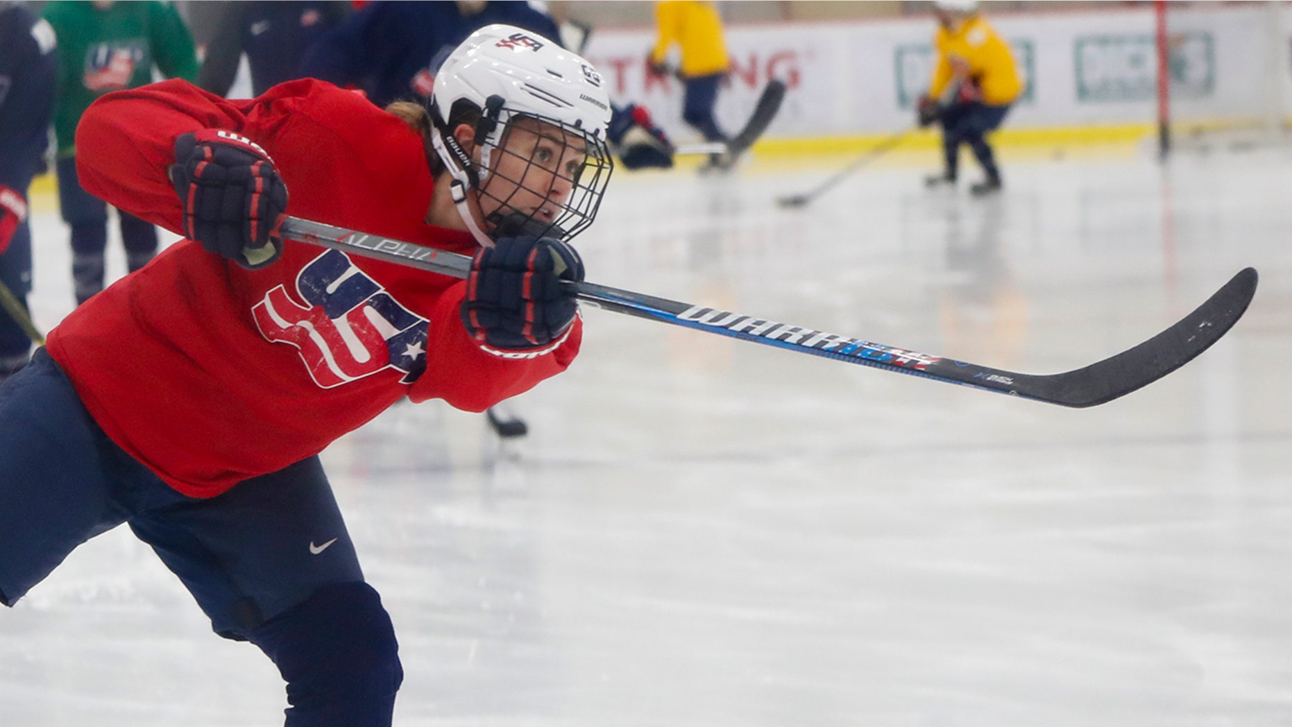 In this Monday, Nov. 4, 2019, photo, Alexandra Carpenter goes through drills while playing with the U.S. Women's National hockey team in Cranberry Township, Butler County, Pa., ahead of scheduled exhibition games against Canada. Carpenter, college hockey's top player in 2015 and daughter of former NHL star Bobby Carpenter, is also leading Russia's Women's Hockey League in scoring while playing for the Chinese-based Shenzhen KRS Vanke Rays. (AP Photo/Keith Srakocic)