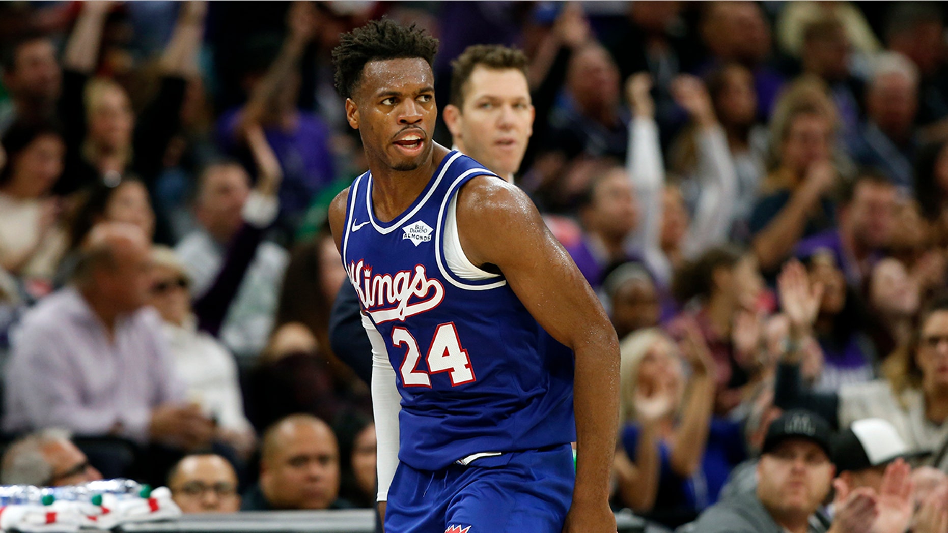 Sacramento Kings guard Buddy Hield runs down court after scoring a 3-point shoot in the closing minutes of the Kings 100-99 win over the Boston Celtics in an NBA basketball game in Sacramento, Calif., Sunday, Nov. 17, 2019. (AP Photo/Rich Pedroncelli)