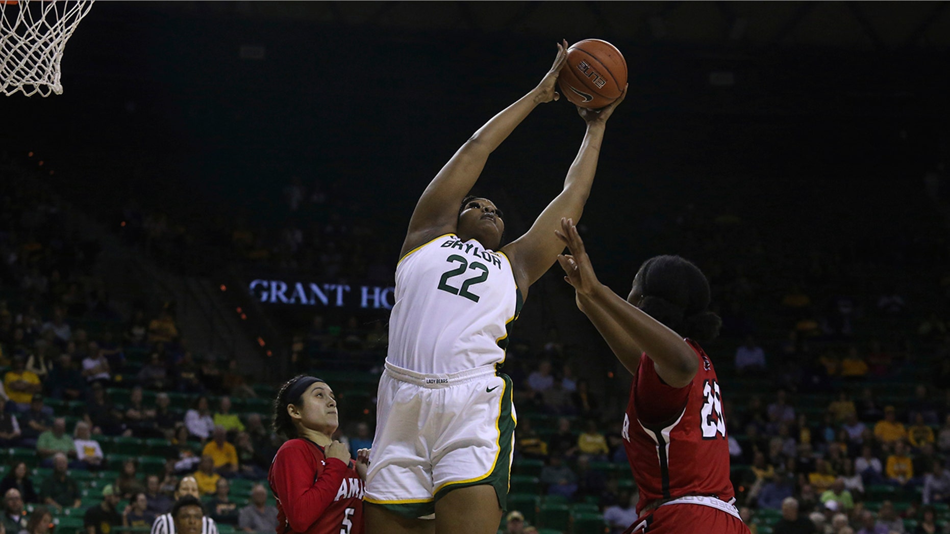 Baylor center Erin DeGrate (22) leaps for the ball against Lamar center Rikiah Cowart (20) and Lamar guard Amber Vidal (5) in the first half of an NCAA college basketball game, Thursday, Nov. 21, 2019, in Waco, Texas. (AP Photo/Jerry Larson)