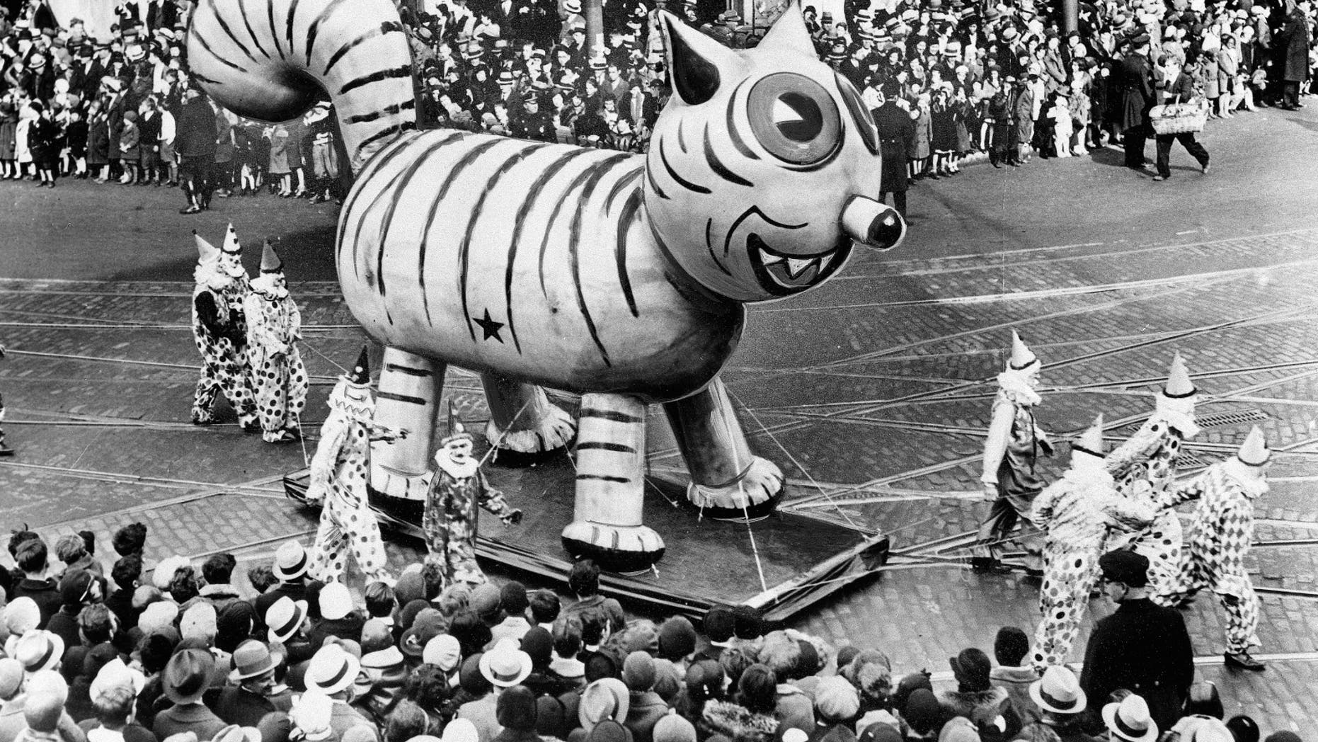 An outdoor float of a big cat makes its way down a street during the Thanksgiving Day Parade in New York City on Nov. 26, 1931. (AP Photo)