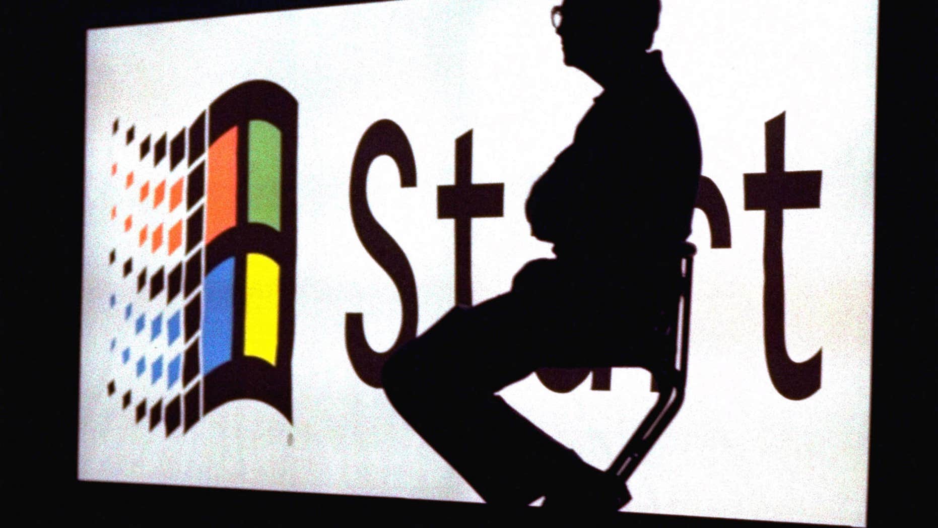 FILE - In this Aug. 24, 1995, file photo, Microsoft Chairman Bill Gates sits on stage during a video portion of the Windows 95 Launch Event on the company's campus in Redmond, Wash. One of the biggest changes with Windows 8 is the disappearance of the familiar start button at the lower left corner of the screen. There will be a new screen filled with a colorful array of tiles, each leading to a different application, task or collection of files. (AP Photo/File)
