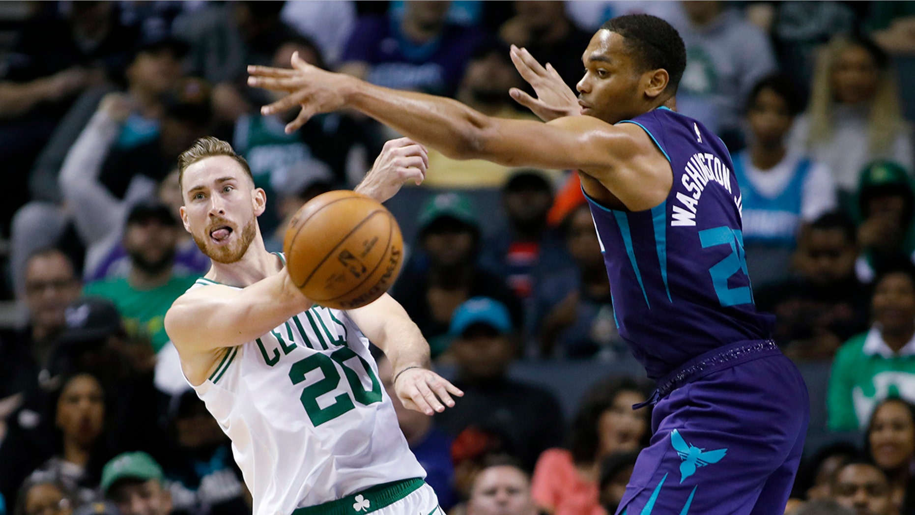 Boston Celtics' Gordon Hayward (20) gets a pass off against Charlotte Hornets' P.J. Washington (25) during the second half of an NBA basketball game in Charlotte, N.C., Thursday, Nov. 7, 2019. The Celtics won 108-87. (AP Photo/Bob Leverone)