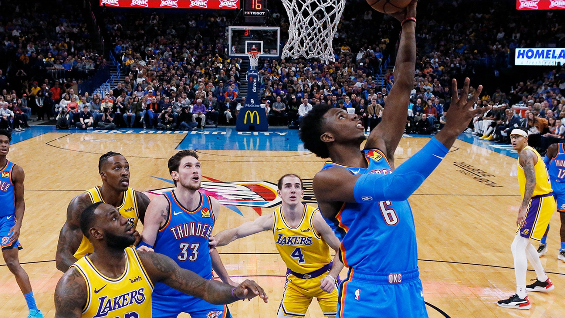 Oklahoma City Thunder guard Hamidou Diallo (6) shoots in front of Los Angeles Lakers forward LeBron James (23) and guard Alex Caruso (4) during the fist half of an NBA basketball game Friday, Nov. 22, 2019, in Oklahoma City. (AP Photo/Sue Ogrocki)
