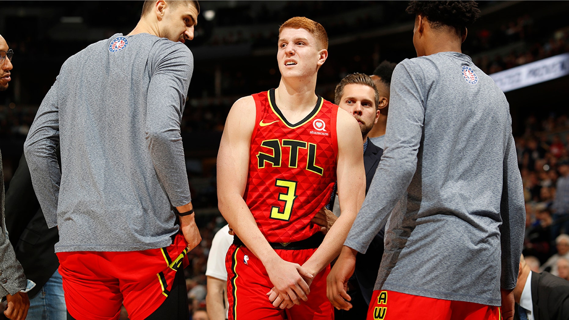 Atlanta Hawks guard Kevin Huerter holds his left wrist after an injury during the second half of the team's NBA basketball game agains the Denver Nuggets on Tuesday, Nov. 12, 2019, in Denver. Atlanta won 125-121. (AP Photo/David Zalubowski)