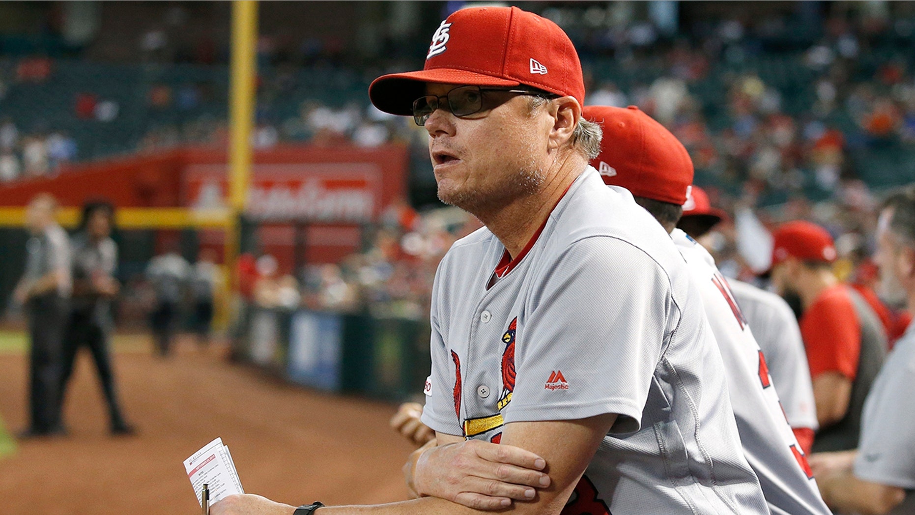 FILE - In this Sept. 25, 2019, file photo, St. Louis Cardinals manager Mike Shildt pauses in the dugout during the fifth inning of the team's baseball game against the Arizona Diamondbacks in Phoenix. Shildt has edged out Craig Counsell of the Milwaukee Brewers to win NL Manager of the Year. (AP Photo/Ross D. Franklin, File)