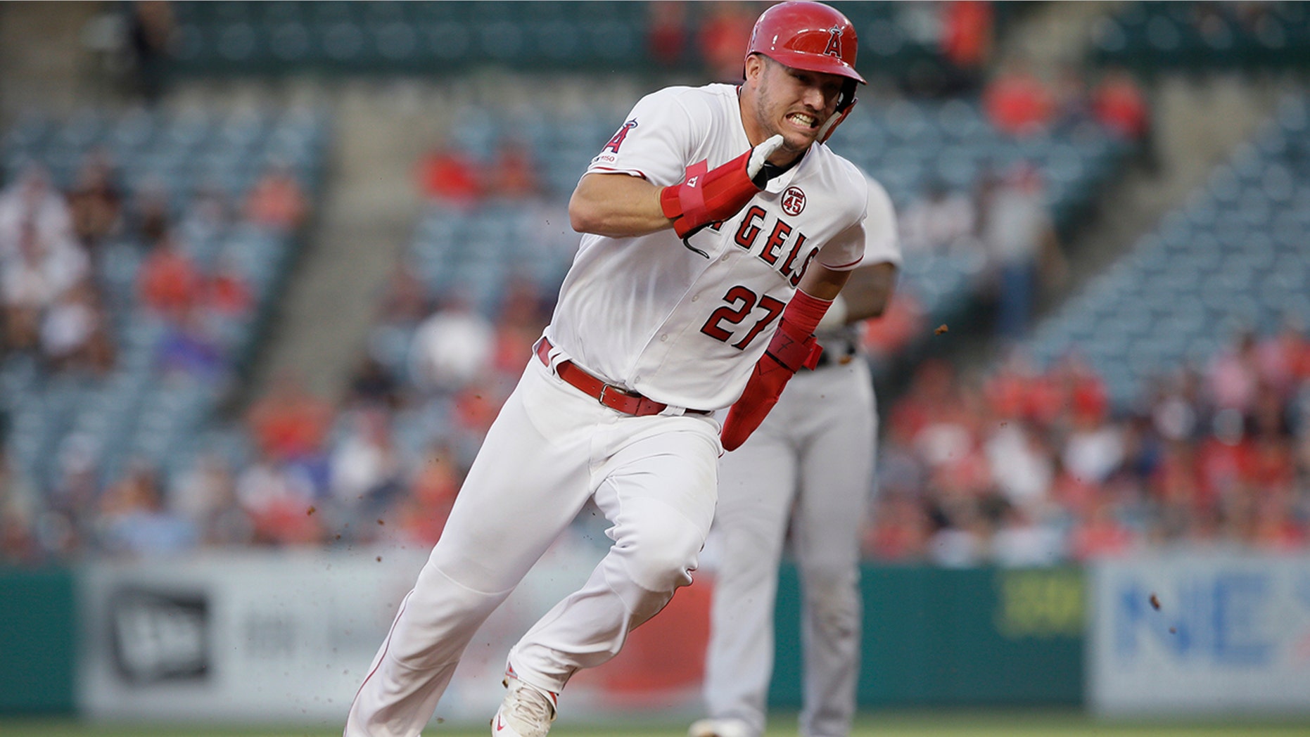 FILE - In this July 30, 2019, file photo, Los Angeles Angels' Mike Trout rounds second to advance to third from first on a single by Shohei Ohtani against the Detroit Tigers during the first inning of a baseball game in Anaheim, Calif. Trout was having another spectacular year for the Angels when right foot problems ended his season early. He did not play after Sept. 7 and was limited to 134 games. (AP Photo/Alex Gallardo, File)