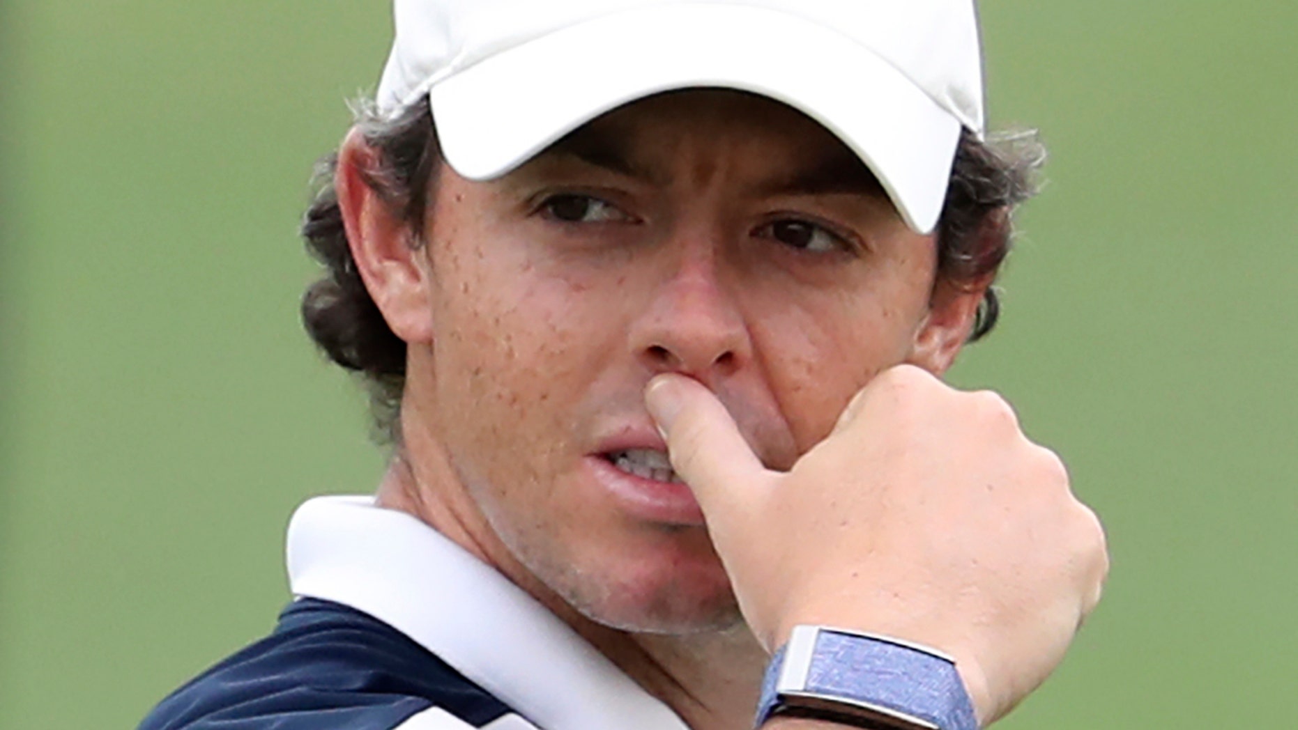 Rory McIlroy of Northern Ireland studies his play on the 2nd hole during the first round of the DP World Tour Championship golf tournament in Dubai, United Arab Emirates, Thursday, Nov. 21, 2019. (AP Photo/Kamran Jebreili)