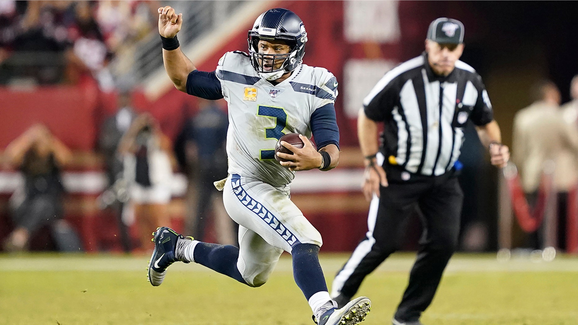 Seattle Seahawks quarterback Russell Wilson (3) runs the ball against the San Francisco 49ers during the second half of an NFL football game in Santa Clara, Calif., Monday, Nov. 11, 2019. (AP Photo/Tony Avelar)