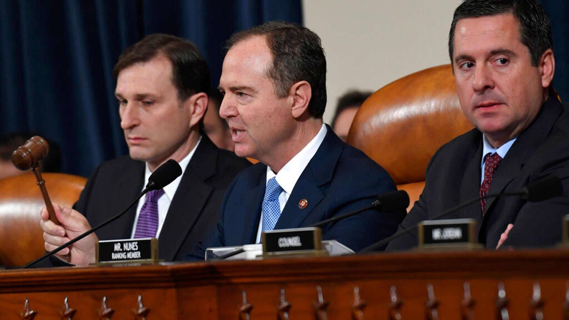 House Intelligence Committee Chairman Adam Schiff, D-Calif., center, flanked by House Democratic Counsel Daniel Goldman, left, and ranking member Devin Nunes, R-Calif. (AP Photo/Susan Walsh)