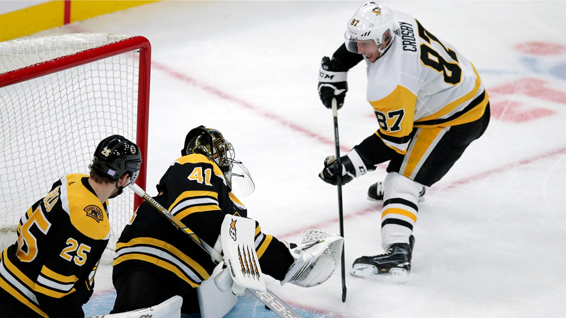 Boston Bruins goaltender Jaroslav Halak (41) makes a save on a shot by Pittsburgh Penguins center Sidney Crosby (87) during the first period of an NHL hockey game in Boston, Monday, Nov. 4, 2019. (AP Photo/Charles Krupa)