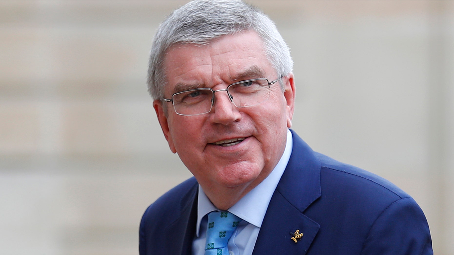 In this June 7, 2019, photo, International Olympic Committee (IOC) president Thomas Bach arrives to meet French President Emmanuel Macron at the Elysee Palace in Paris. An international trade union wants Bach to intervene and investigate alleged labor and safety violations at venues being built for next year’s Tokyo Olympics. (AP Photo/Francois Mori, File)
