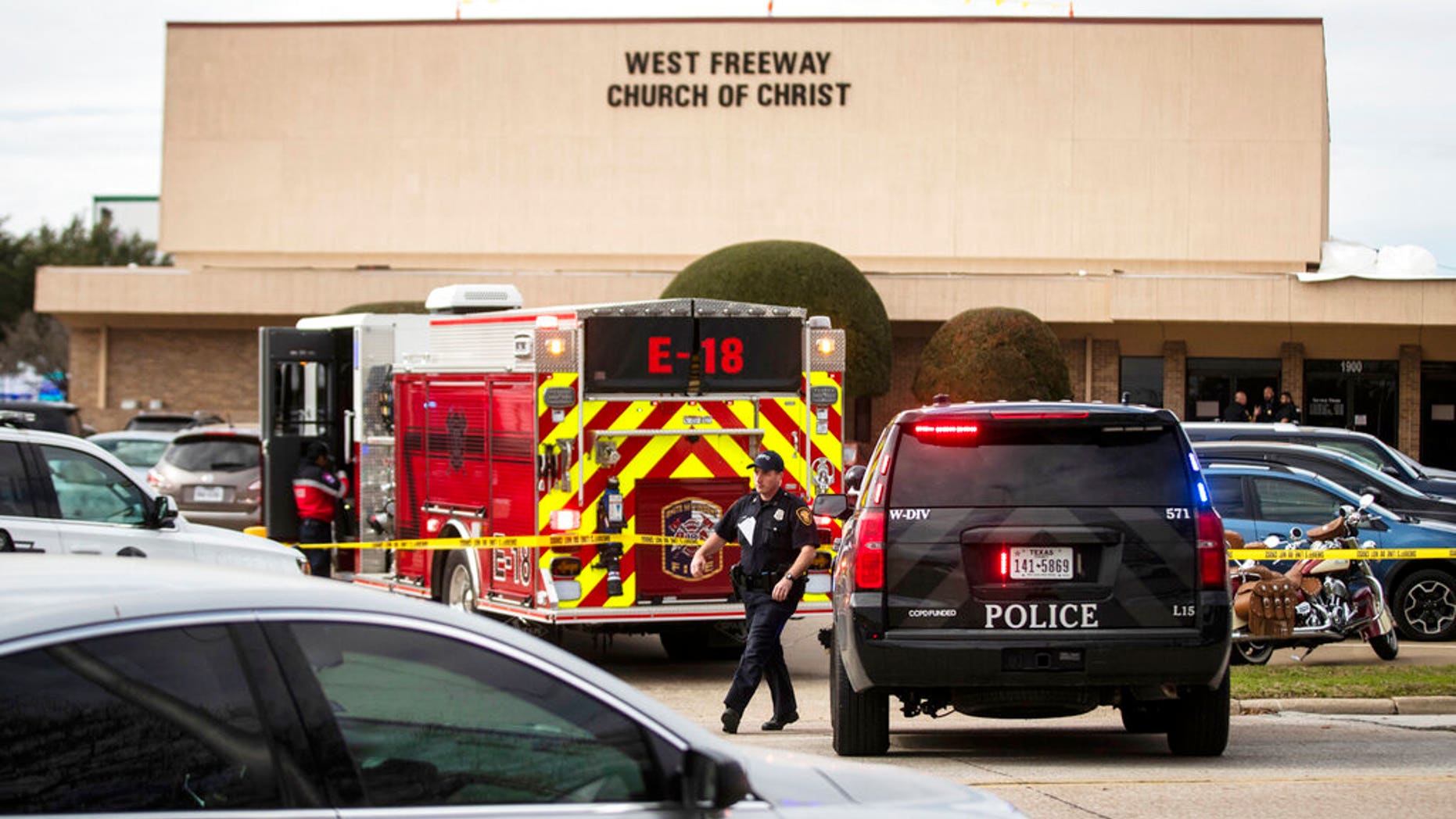 Police and fire departments surround the scene of a shooting at West Freeway Church of Christ in White Settlement, Texas. (Yffy Yossifor/Star-Telegram via AP)