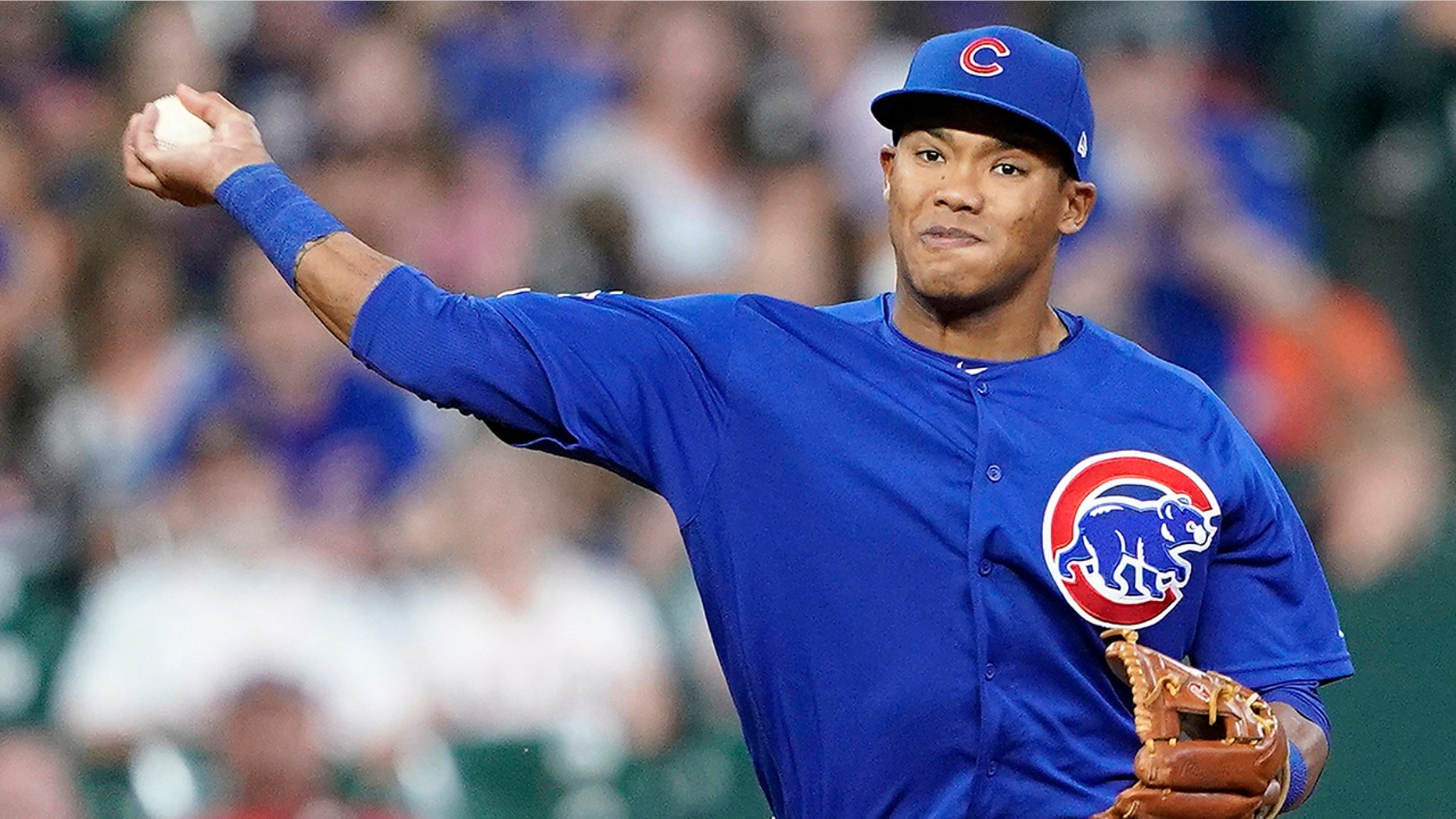 FILE - In this May 29, 2019, file photo, Chicago Cubs shortstop Addison Russell throws to first during the eighth inning of a baseball game against the Houston Astro in Houston. The Cubs failed to offer a 2020 contract to Russell on Monday, Dec. 2, 2019, making the 2016 All-Star a free agent one year after he was suspended for violating Major League Baseball’s domestic violence policy. (AP Photo/David J. Phillip, File)