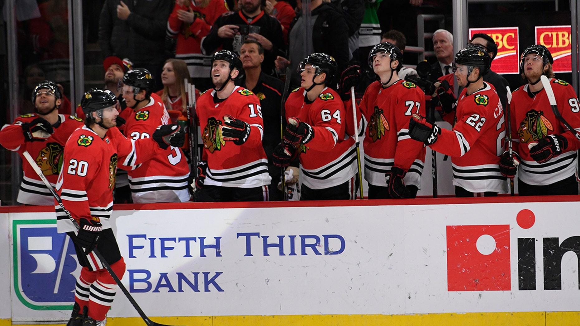 Chicago Blackhawks' Brandon Saad (20) celebrates with teammates on the bench after scoring a goal during the third period of an NHL hockey game against the Minnesota Wild, Sunday, Dec. 15, 2019, in Chicago. AP Photo/Paul Beaty)