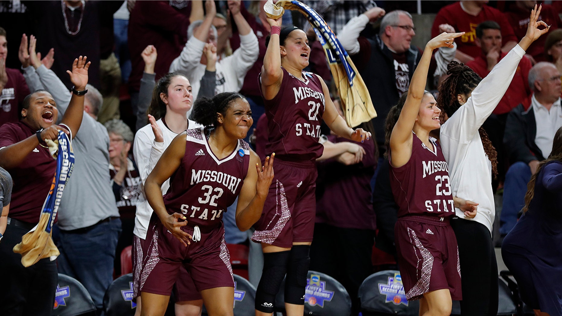 FILE - In this Monday, March 25, 2019, file photo, Missouri State forward Jasmine Franklin, left, guard Sydney Wilson, center, and guard Mya Bhinhar, right, celebrate a 3-point basket by guard Sydney Manning during the second half against Iowa State in the second round of the NCAA women's college basketball tournament, in Ames, Iowa. In the first week of December 2019, Missouri State is ranked for the first time in 15 years. Franklin, Wilson and Bhinhar are returning players from a squad that reached last season's Sweet 16. (AP Photo/Matthew Putney, File)