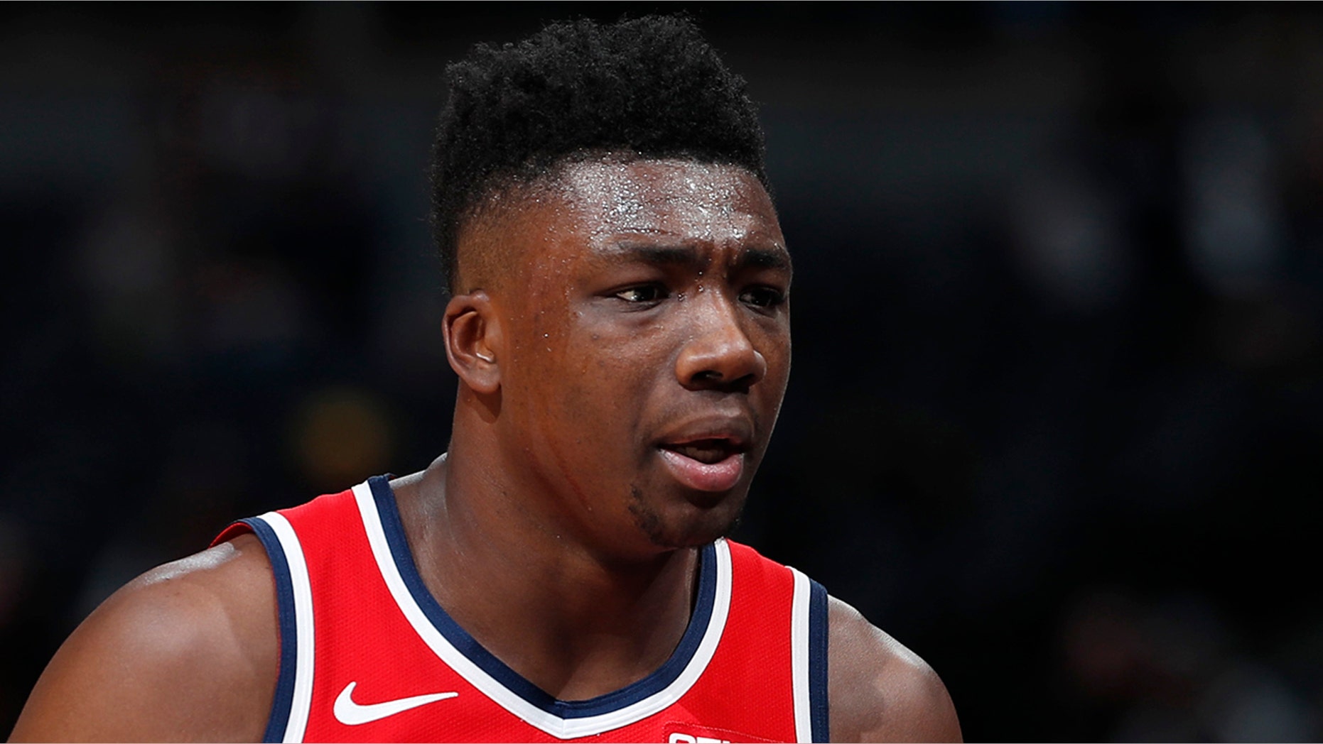 Washington Wizards center Thomas Bryant heads to the bench after drawing two quick fouls against the Denver Nuggets in the first half of an NBA basketball game Tuesday, Nov. 26, 2019, in Denver. (AP Photo/David Zalubowski)