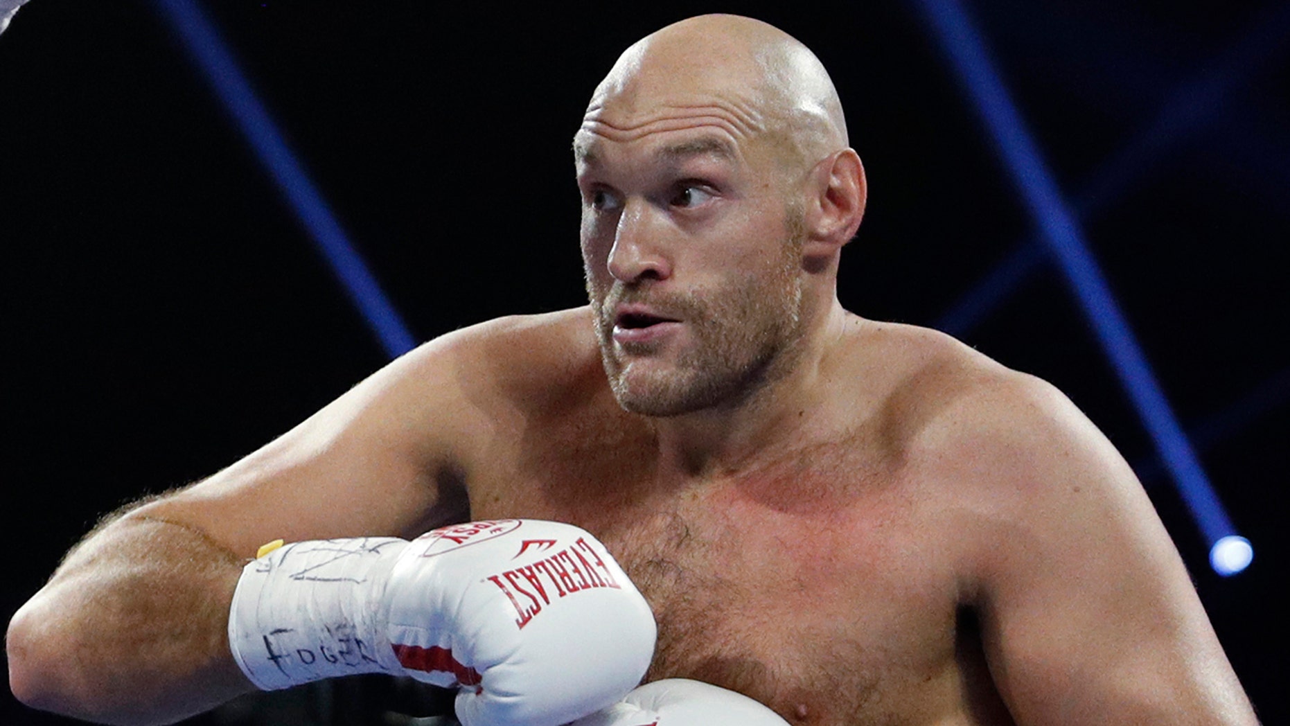 FILE - In this file photo dated Saturday, June 15, 2019, Tyson Fury, of England in action against Tom Schwarz of Germany, in Las Vegas, USA. Tyson Fury has changed trainers just two months before his likely heavyweight rematch with WBC champion Deontay Wilder, it is revealed Monday Dec. 16, 2019. (AP Photo/John Locher, FILE)