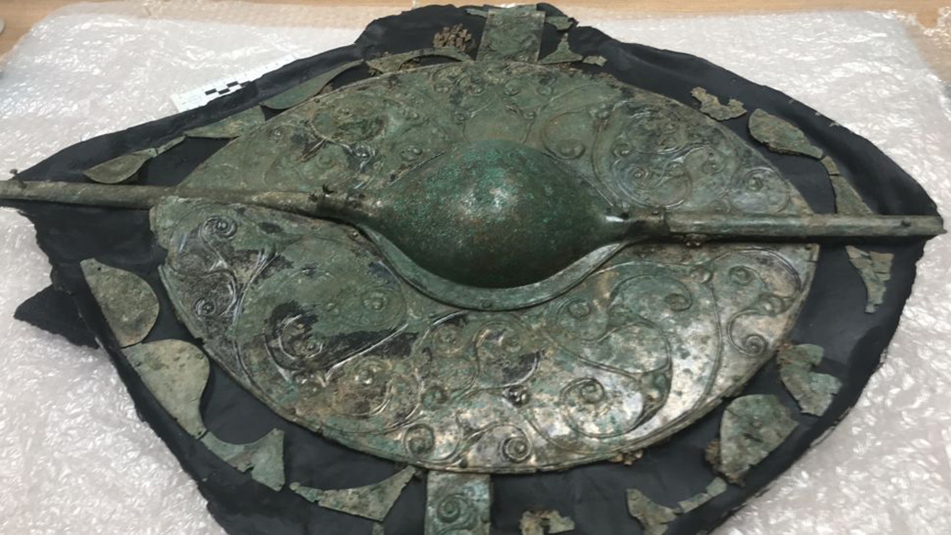 About 30 inches (75 centimeters) in diameter, this shield was found in July 2018; but it wasn't until conservation was complete that its decorations and details could be seen. (Credit: Map Archaeological Practice)