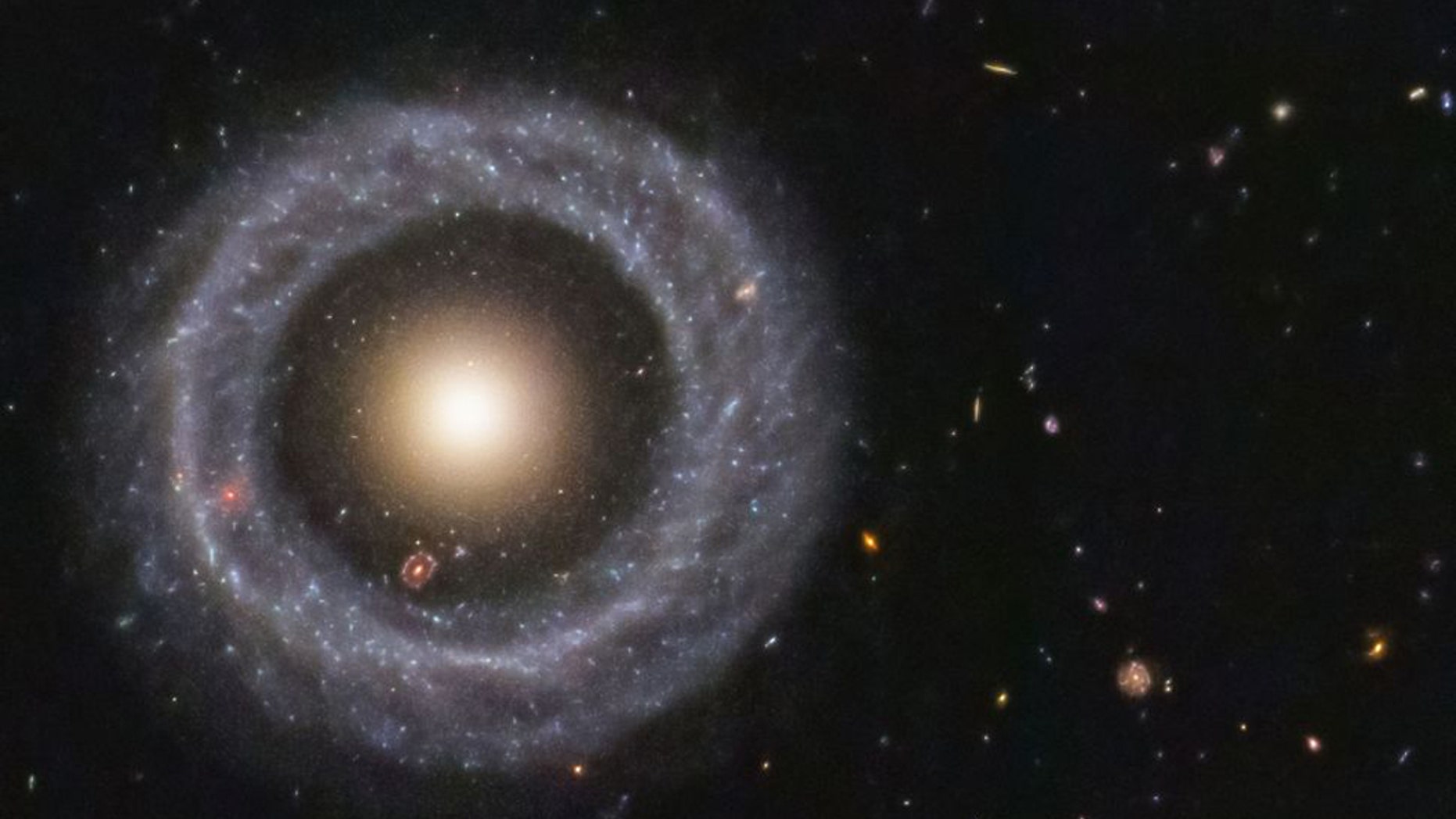 With a perfectly symmetrical ring circling a red sphere of stars, Hoag's object is one of the prettiest mysteries in the universe. (Credit: NASA/ESA/Hubble)