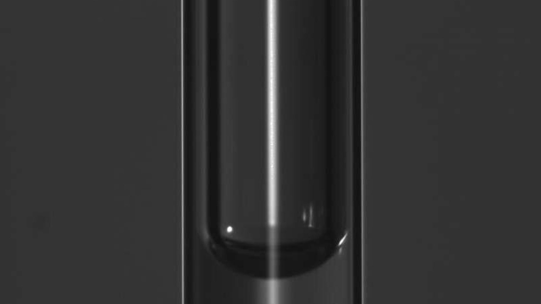 A student just solved the mystery of why bubbles appear stuck in thin vertical tubes. (Credit: EPFL)