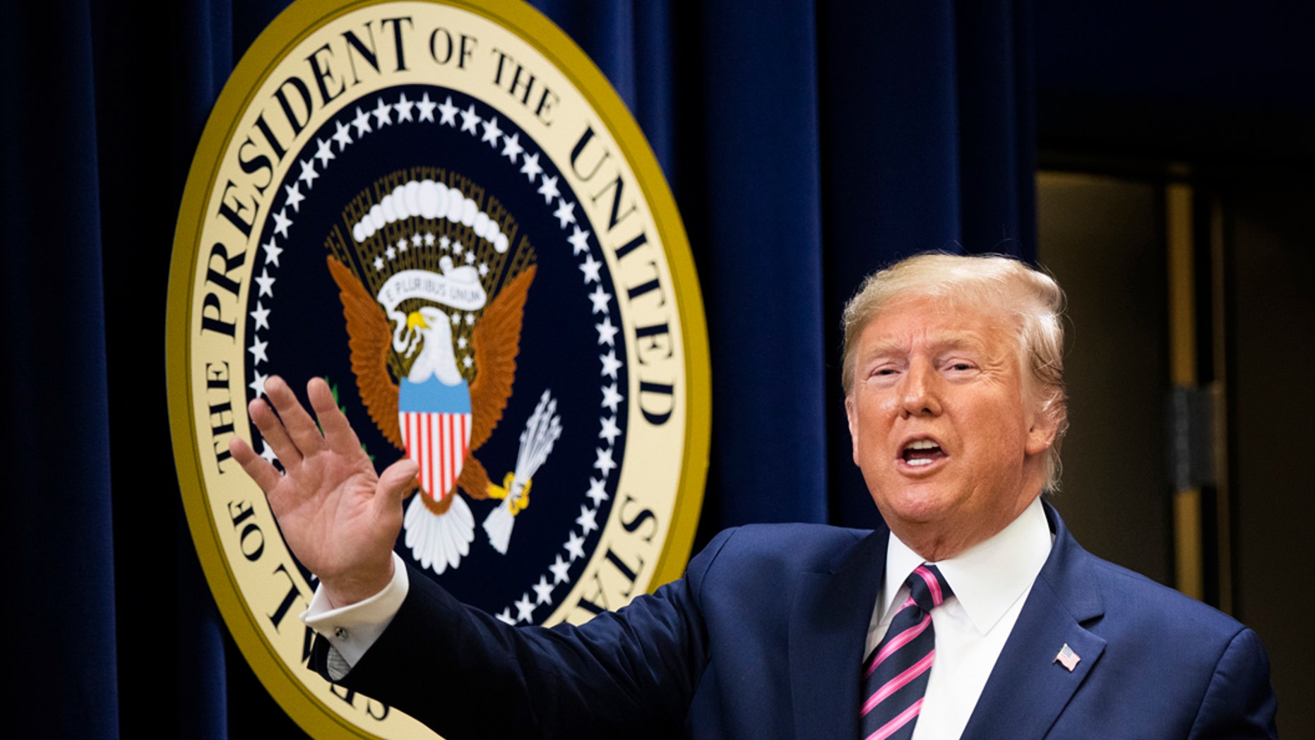 President Donald Trump waves during a summit on transforming mental health treatment to combat homelessness, violence, and substance abuse, at the Eisenhower Executive Office Building on the White House complex in Washington, Thursday, Dec. 19, 2019, in Washington. (AP Photo/Manuel Balce Ceneta)