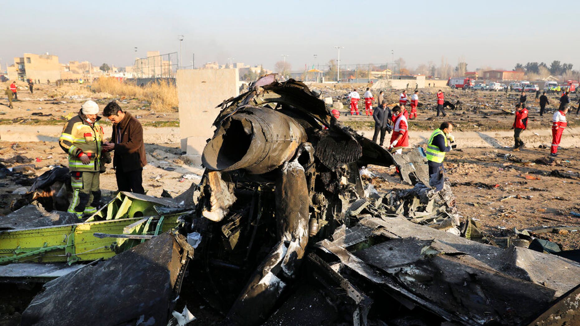 FILE - In this Wednesday, Jan. 8, 2020 file photo debris at the scene where a Ukrainian plane crashed in Shahedshahr southwest of the capital Tehran, Iran. (AP Photo/Ebrahim Noroozi)
