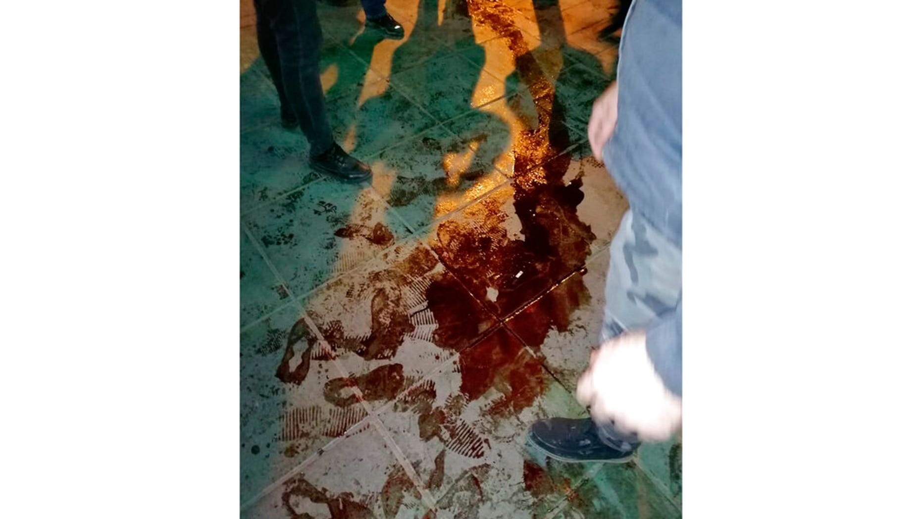 This Sunday, Jan. 12, 2020, photo provided by the New York-based Center for Human Rights in Iran, shows a pool of blood near Azadi, or Freedom, Square after police broke up a demonstration in Tehran, Iran. (Center for Human Rights in Iran via AP)