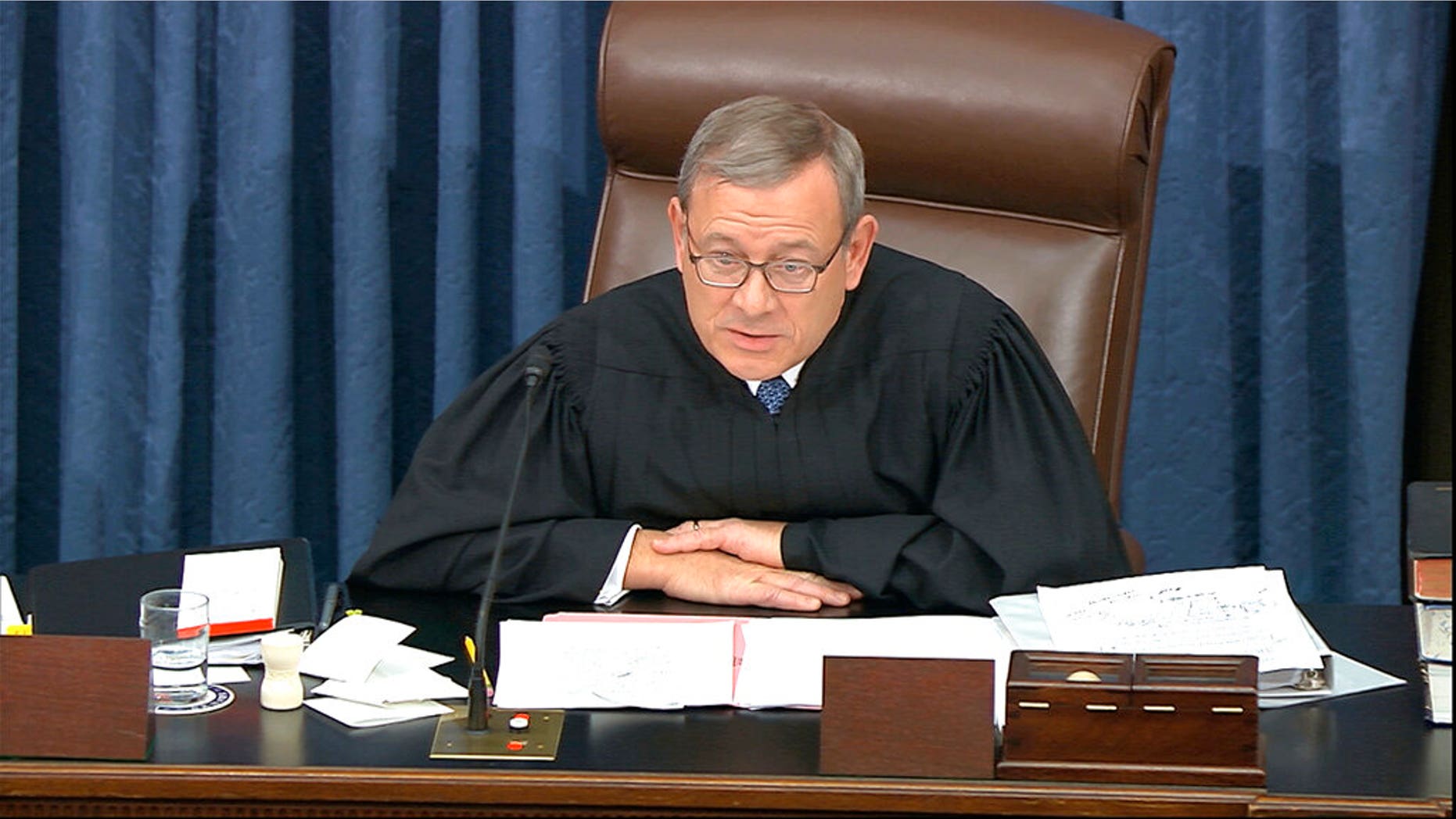 Supreme Court Chief Justice John Roberts admonishes the impeachment managers and president's counsel in equal terms as he speaks during the impeachment trial against President Donald Trump in the Senate. (Senate Television via AP)