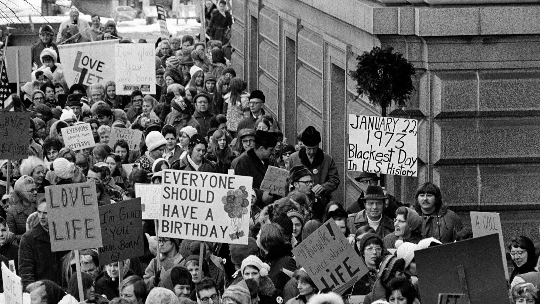 An estimated 5,000 people, women and men, march around the Minnesota Capitol building protesting the U.S. Supreme Court's Roe v. Wade decision, ruling against state laws that criminalize abortion, in St. Paul, Minn., Jan. 22, 1973. The marchers formed a "ring of life" around the building. (AP Photo)