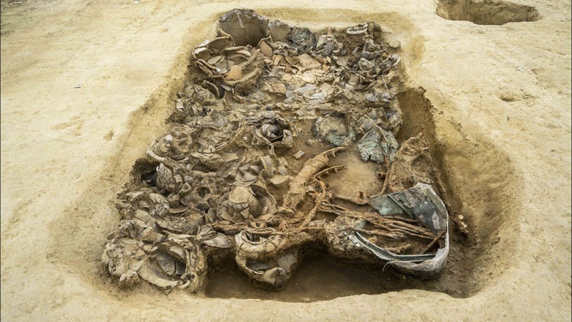 The rich assemblage of grave goods indicates that the person buried here held a high status. (Credit: Pierluigi Giorgi, copyright Antiquity Publications Ltd.)
